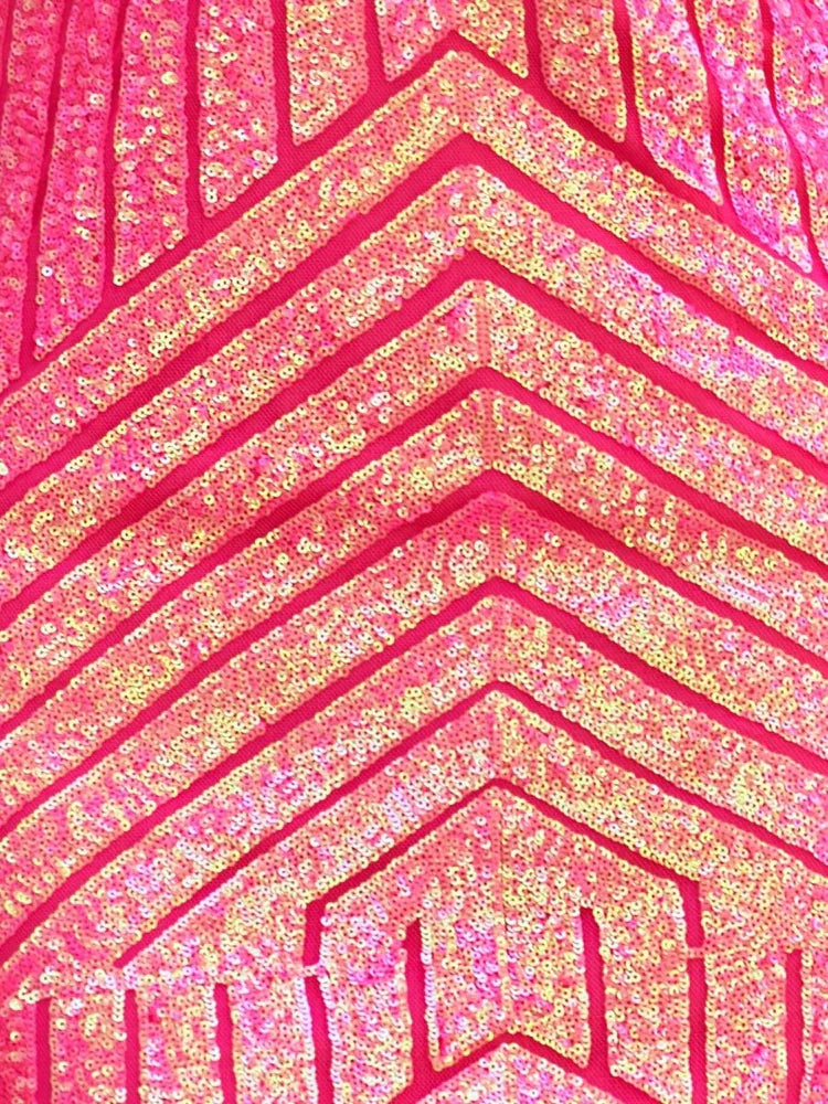 Close-up of hot pink sequin fabric with zigzag pattern