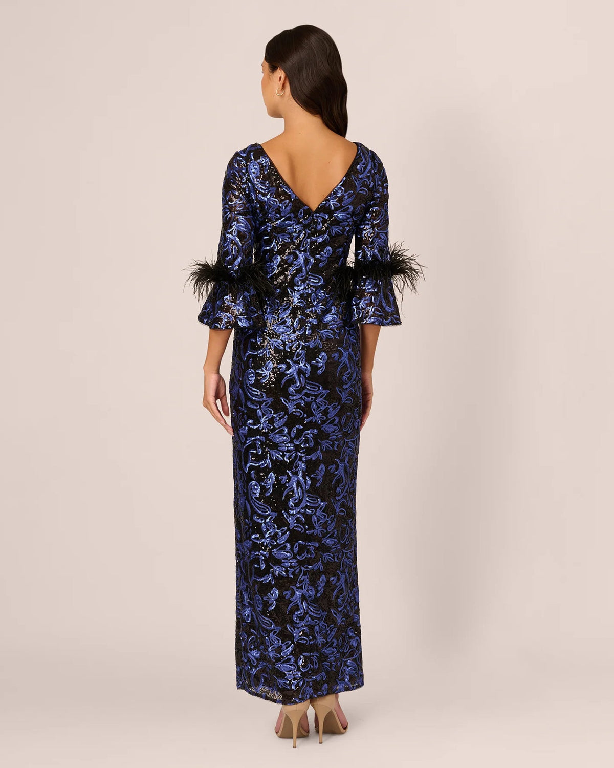 Navy-blue sequin A-line maxi dress with V-back and feather-trim sleeves
