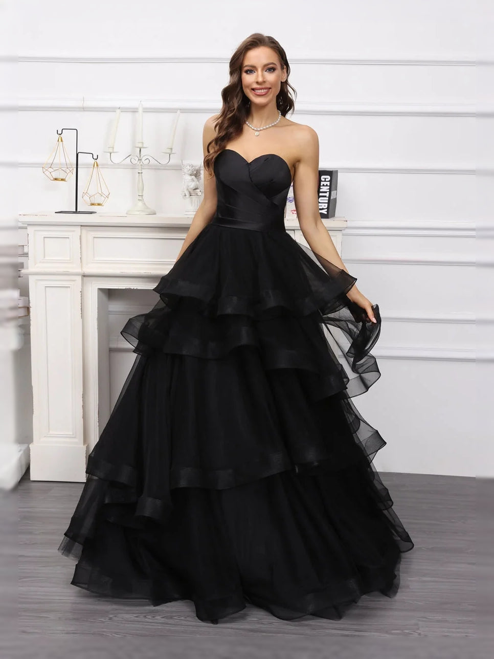 Black sweetheart A-line satin wedding dress with tiered ruffle skirt, full floor-length silhouette