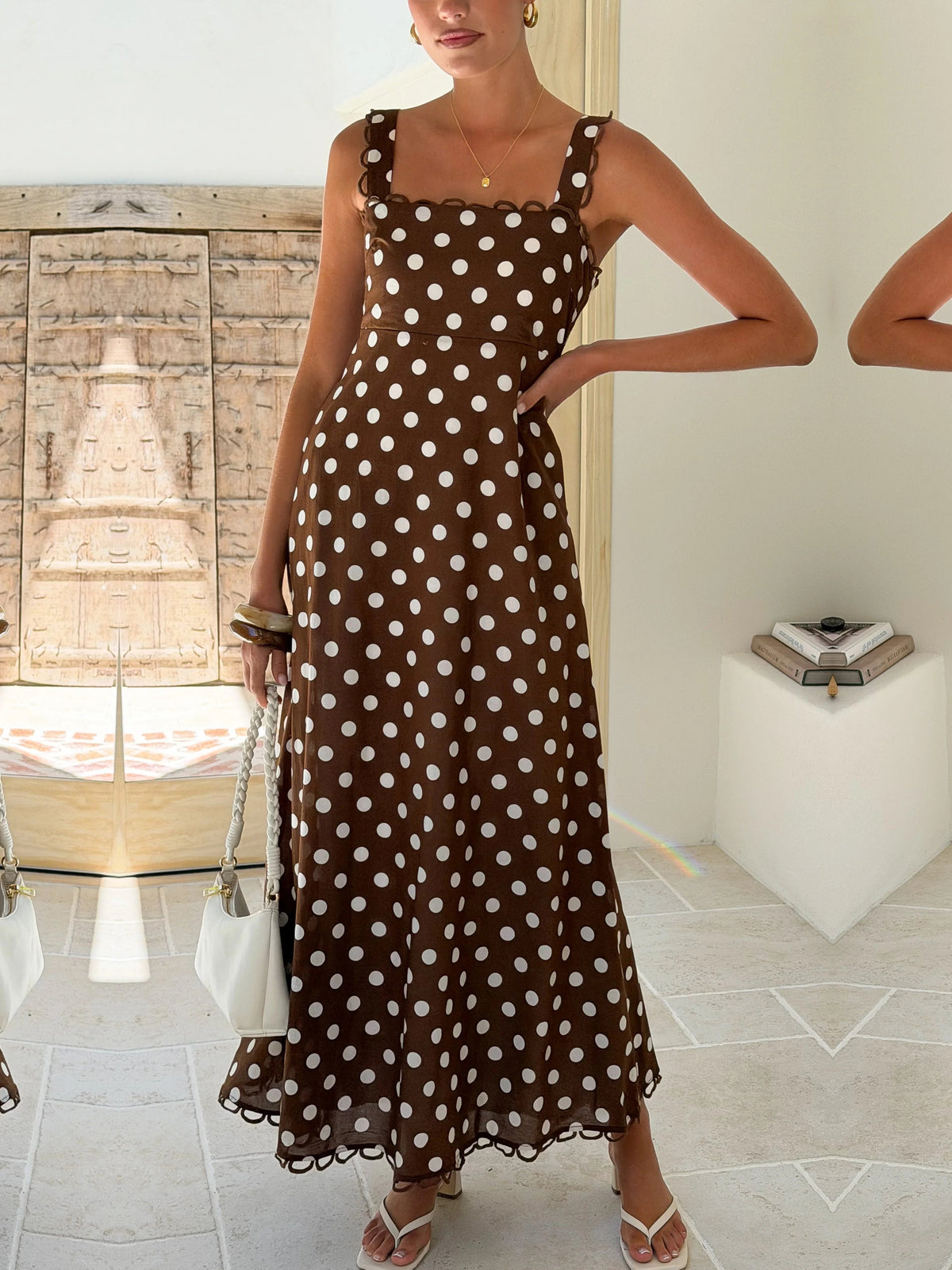 Brown a-line maxi formal dress with printed pattern, alternate view showing the hem