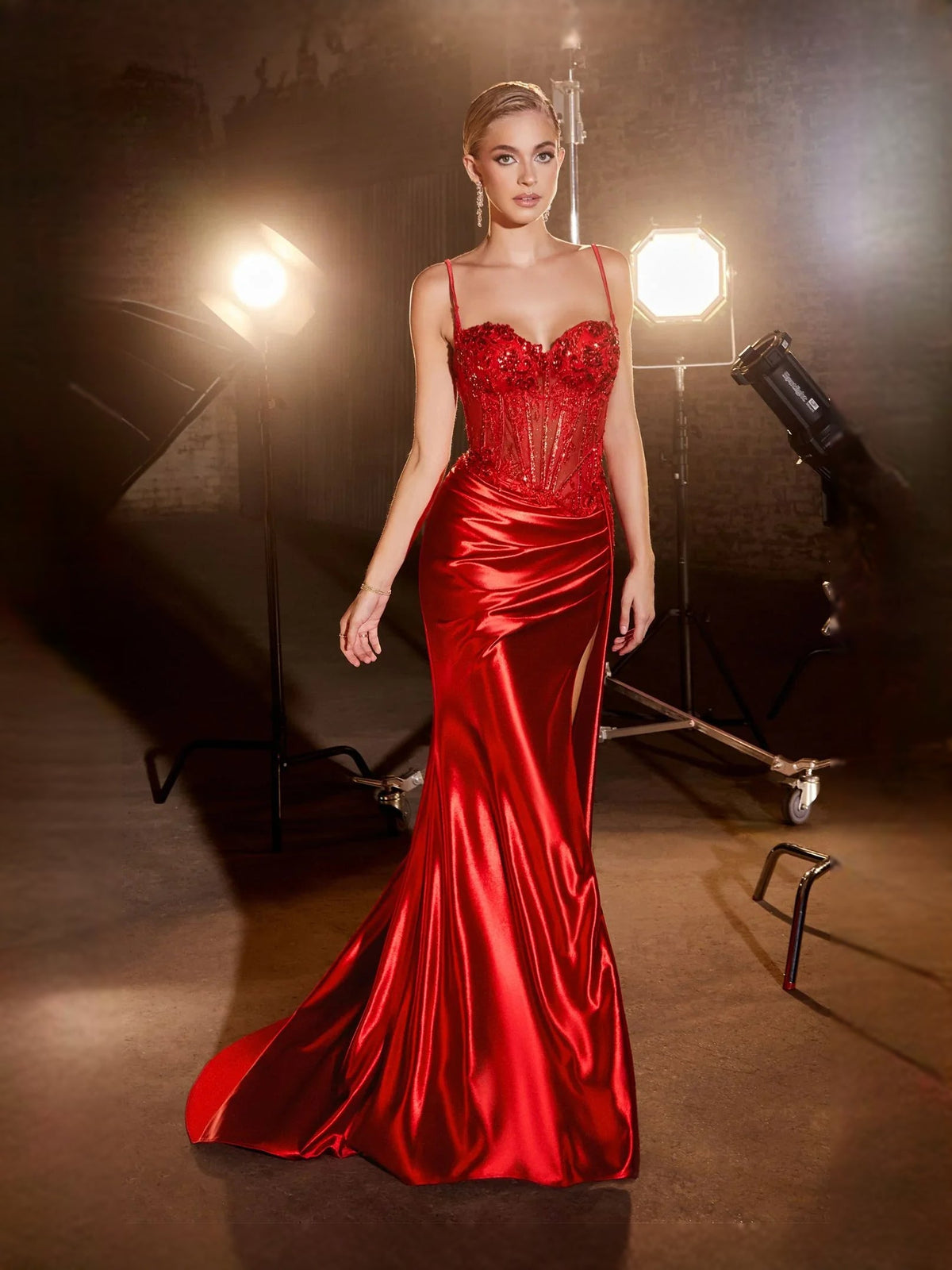 Red satin mermaid prom dress with corset bodice, sweetheart neckline, and floor-length hem