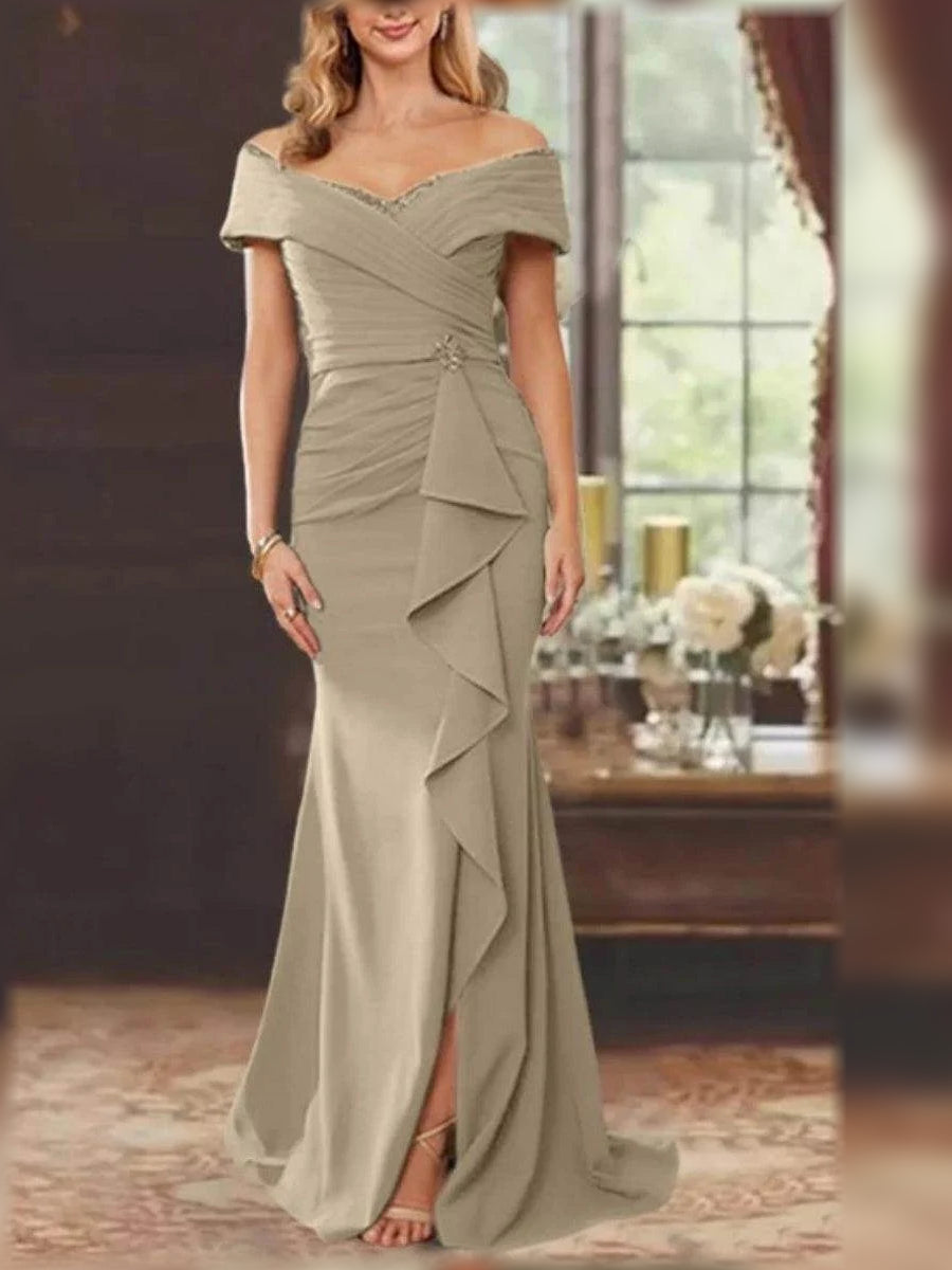 Champagne off-shoulder mermaid dress with ruched bodice and draped ruffle skirt detail.