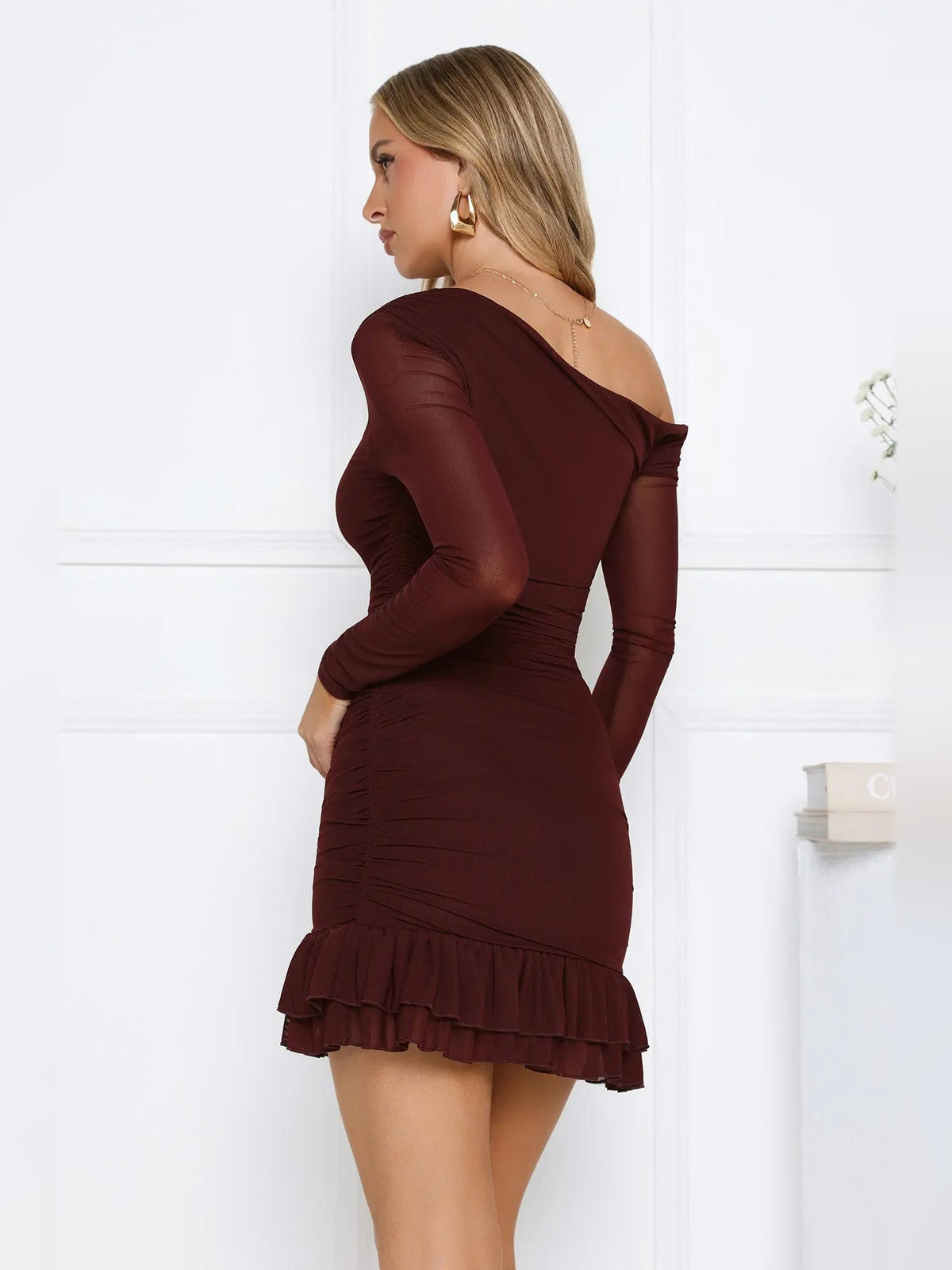 Chocolate off-shoulder long-sleeve mini dress, back view; ruched waist and ruffle hem