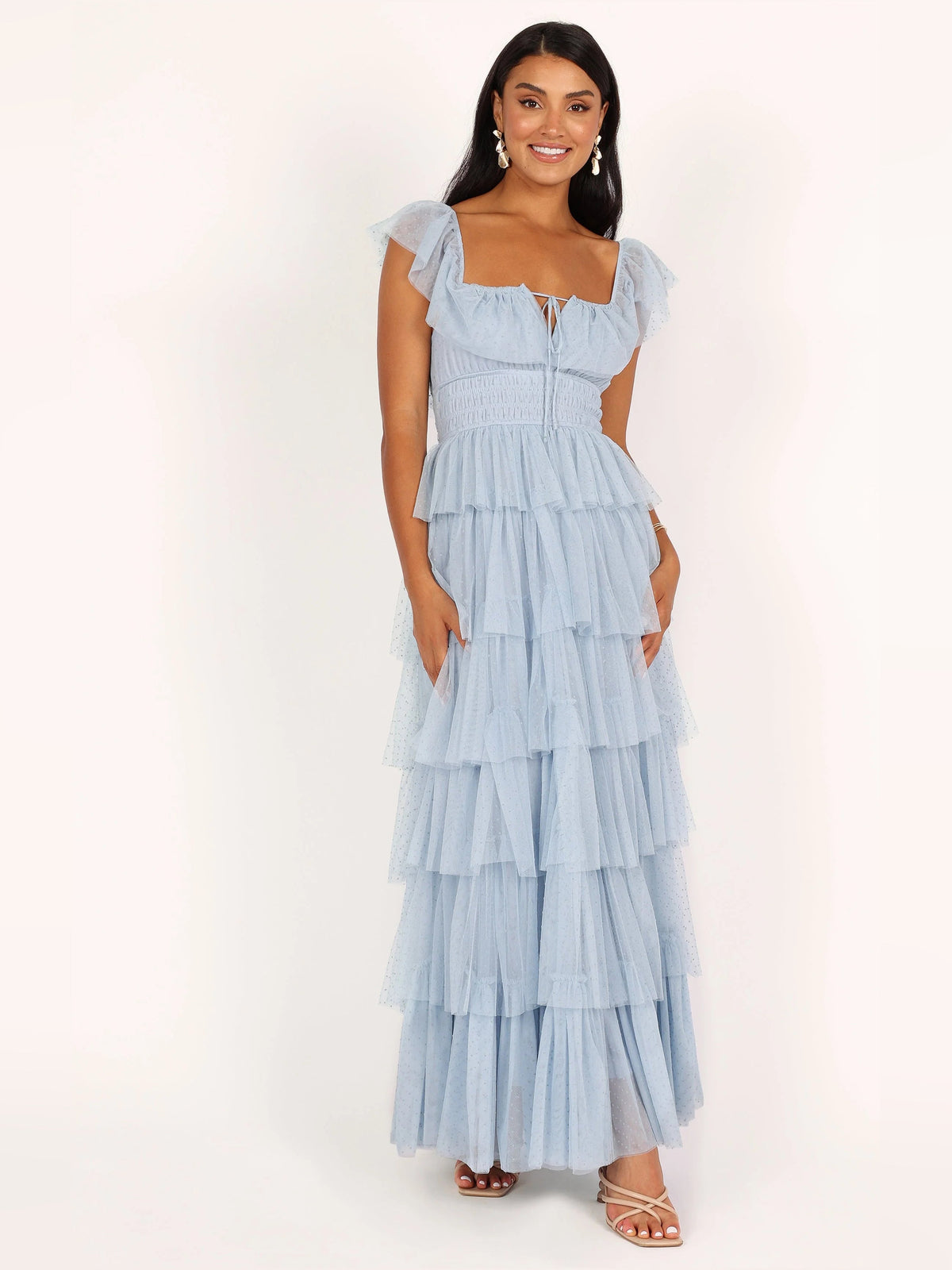 Blue a-line maxi formal dress with ruffle details, alternate full-length view showing the hem