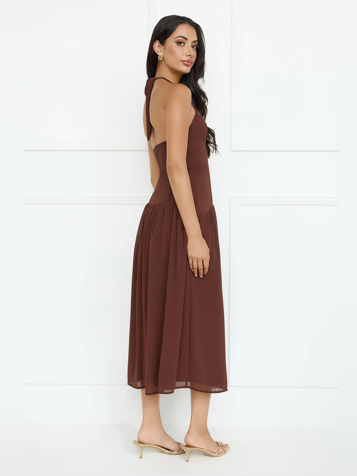 Brown halter V-neck midi formal dress with gathered skirt, side profile
