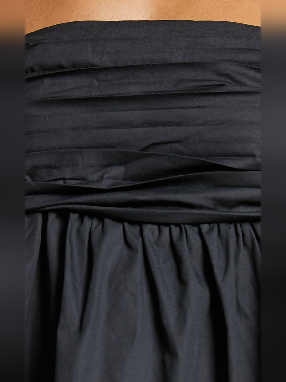 Black ruched bodice and gathered skirt with soft folds