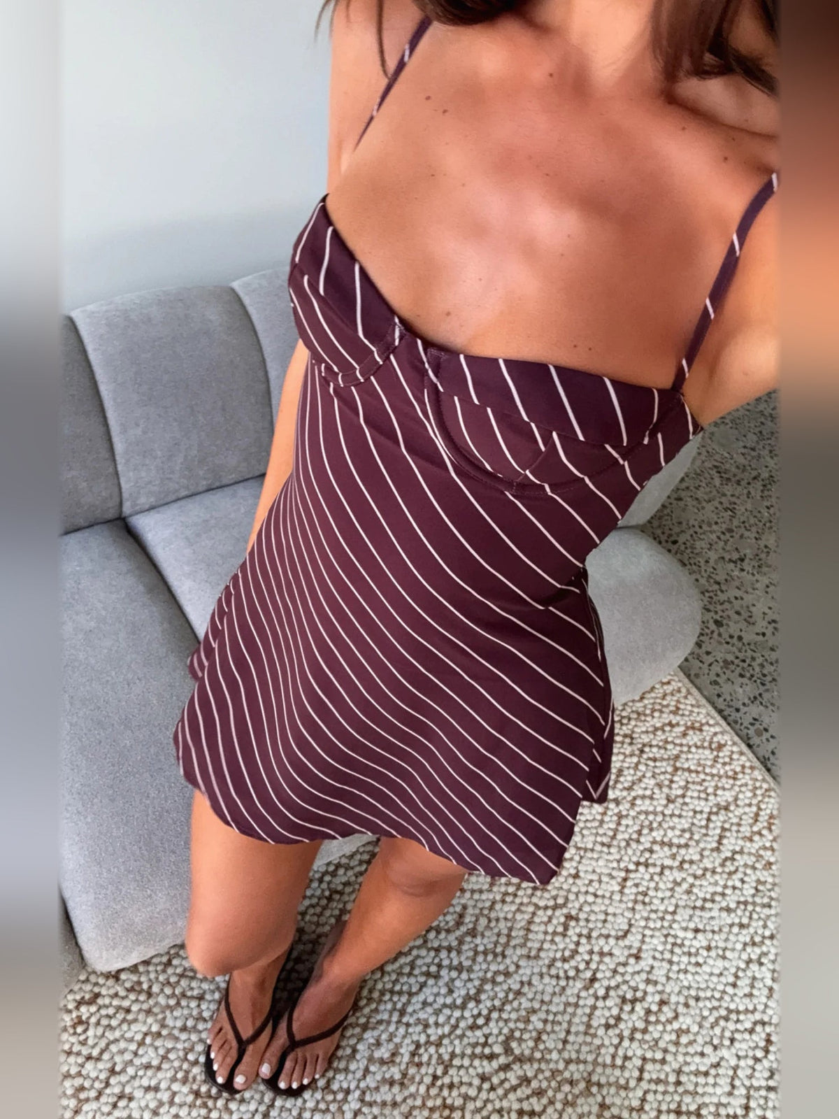 Burgundy pinstripe mini dress close-up of sweetheart bodice and thin straps
