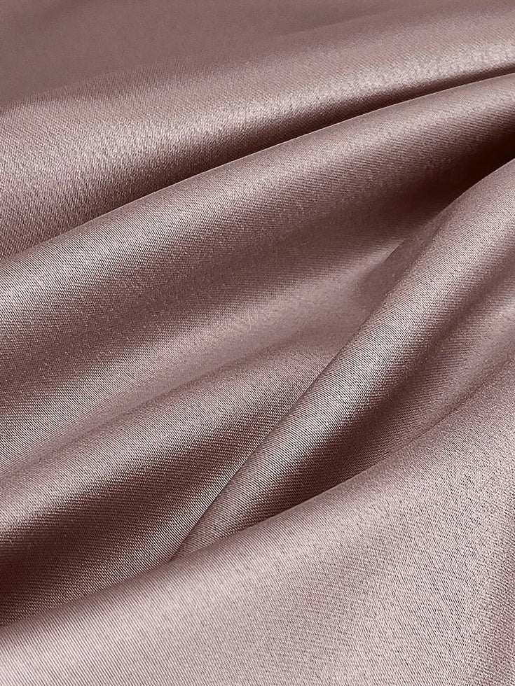 Blush pink satin fabric with smooth woven texture