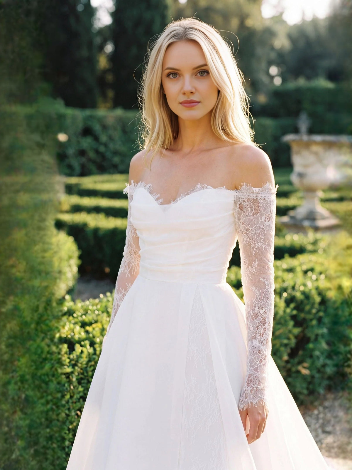 Ivory off-shoulder wedding dress with lace long sleeves and ruched sweetheart bodice