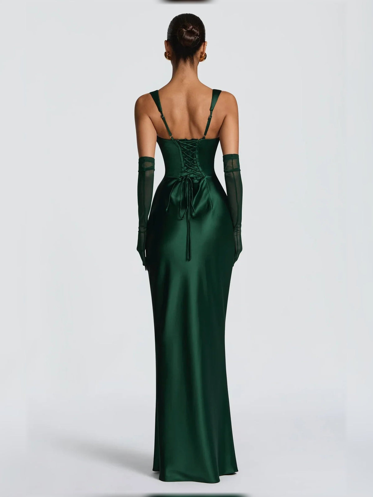 Deep green corset formal dress with ruched back and spaghetti straps, floor-length