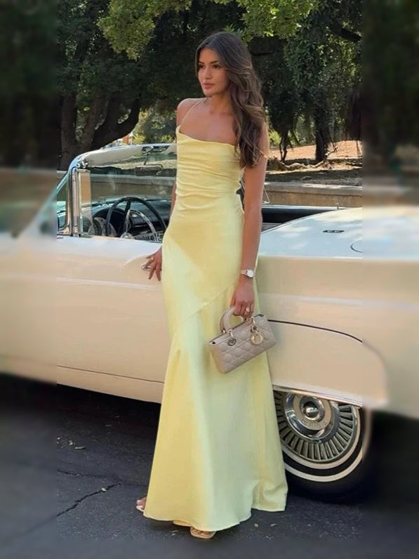 Pale yellow cowl-neck corset formal maxi dress with open back and spaghetti straps