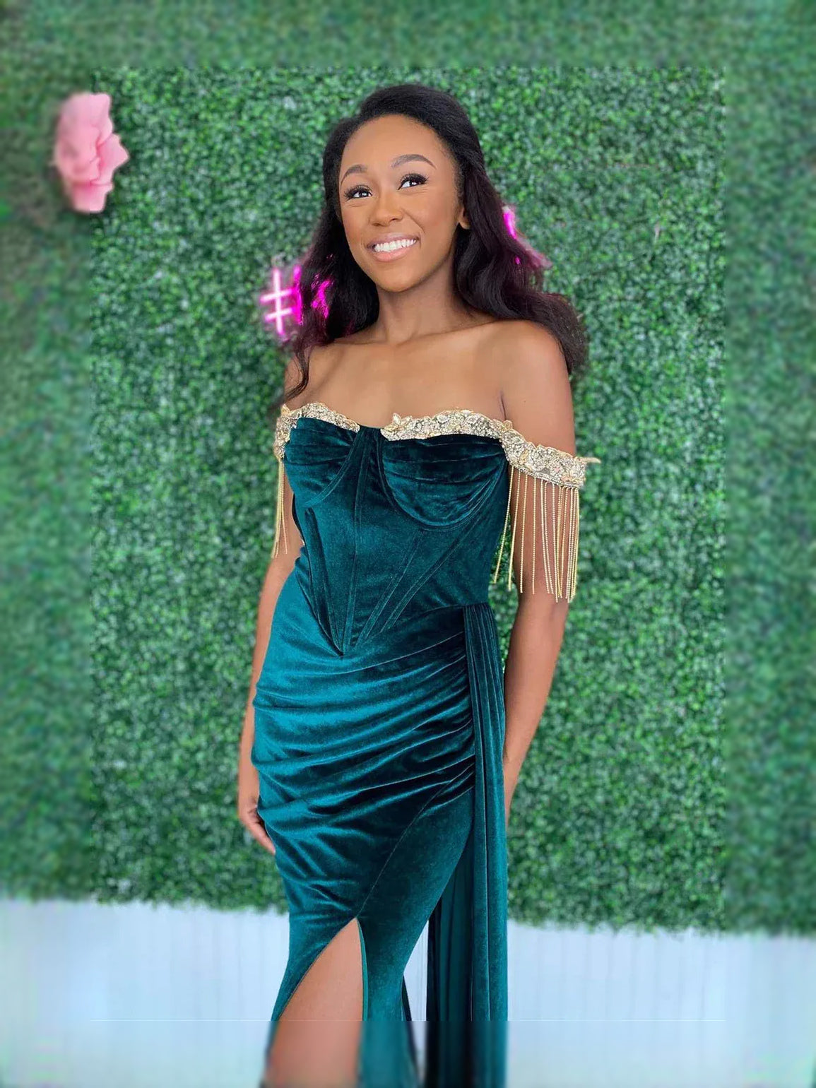 Emerald green velvet sweetheart prom dress with ruched bodice and draped off-shoulder sleeves