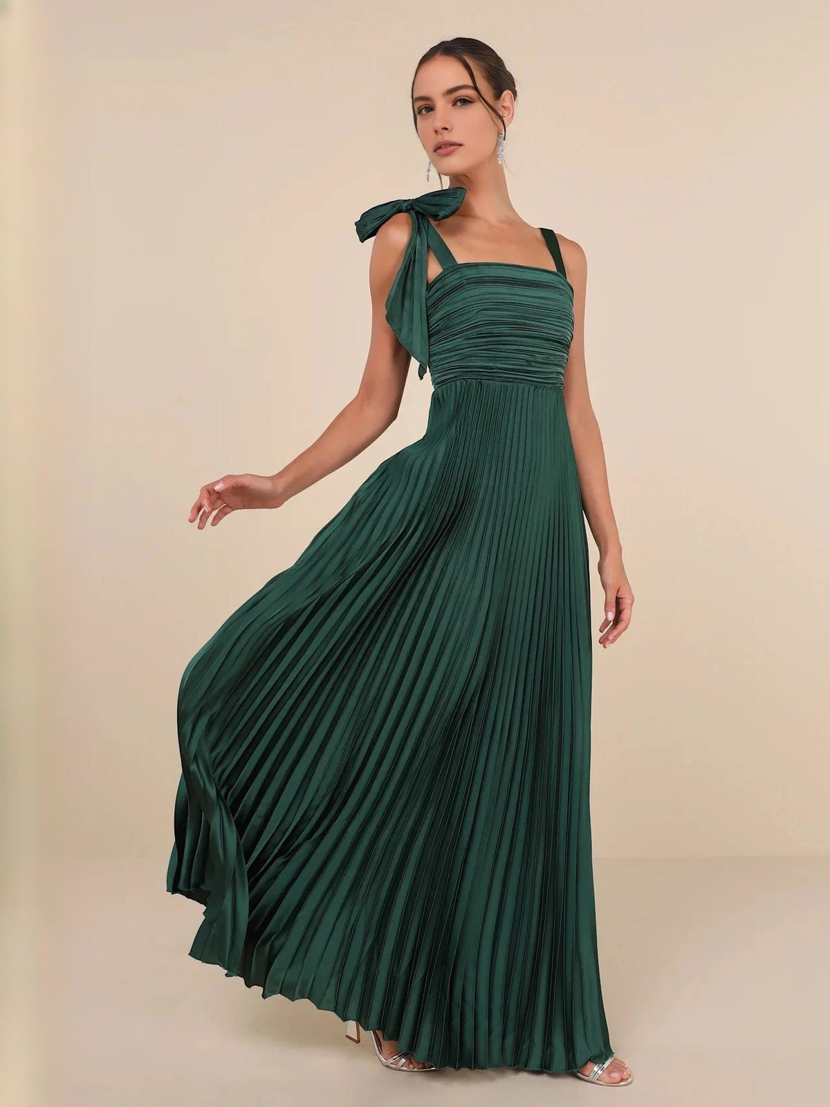 Emerald green satin A-line maxi dress, square neckline, ruched bodice, pleated flowing skirt