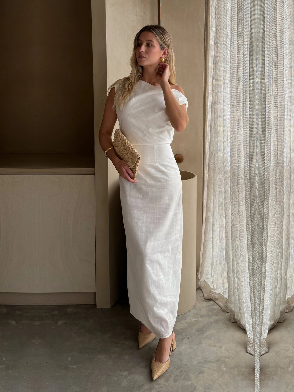 White sheath maxi formal dress with off-the-shoulder neckline, alternate view showing the hem