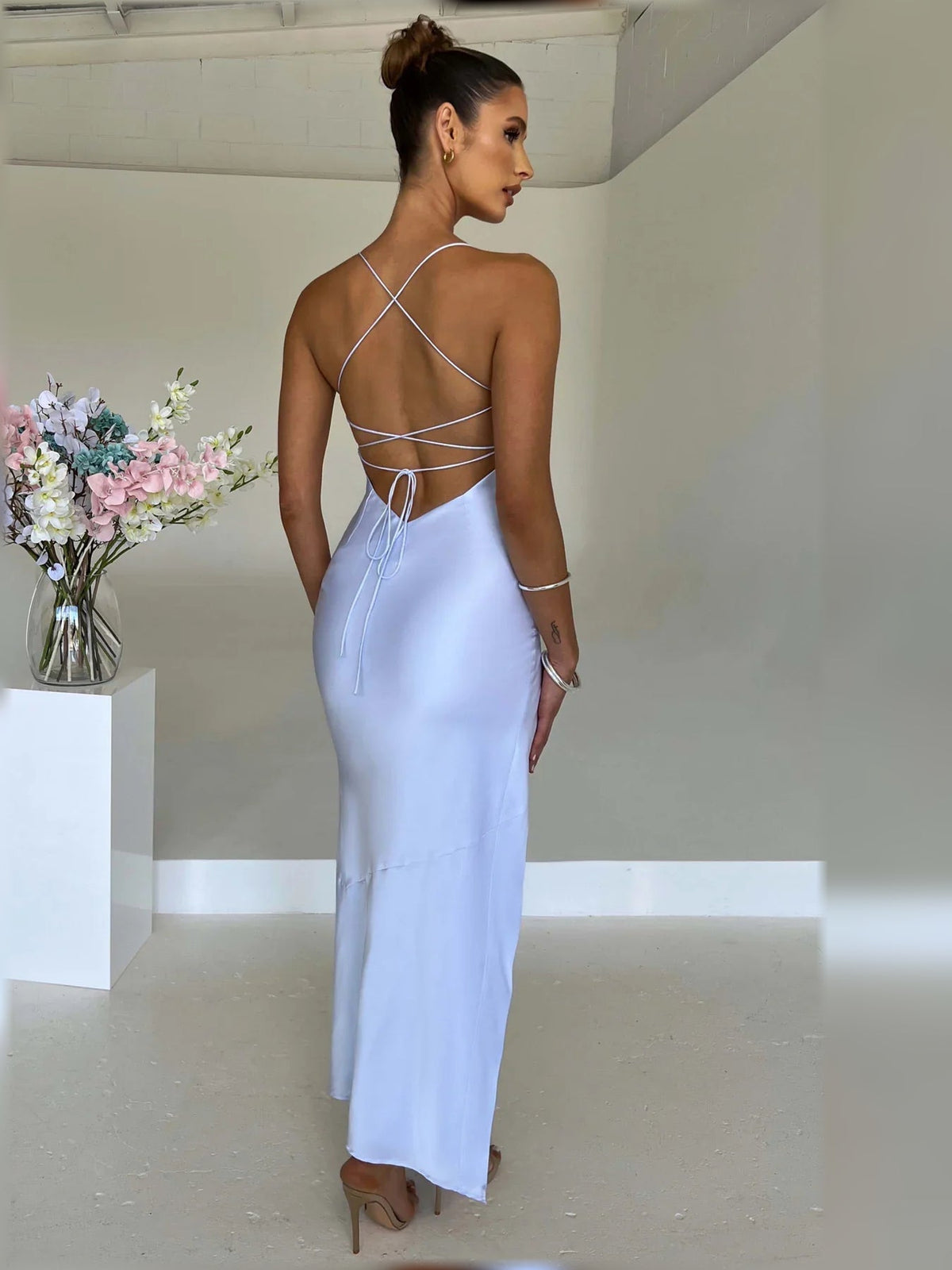 Light blue satin formal dress with open back and crisscross tie straps