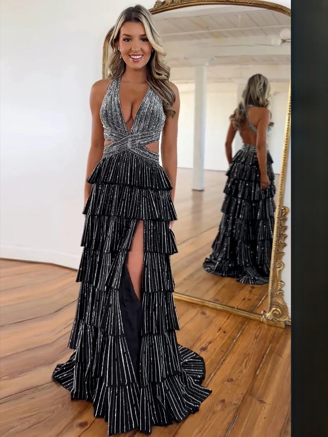Black V-neck tiered prom dress with beaded shimmer and high side slit