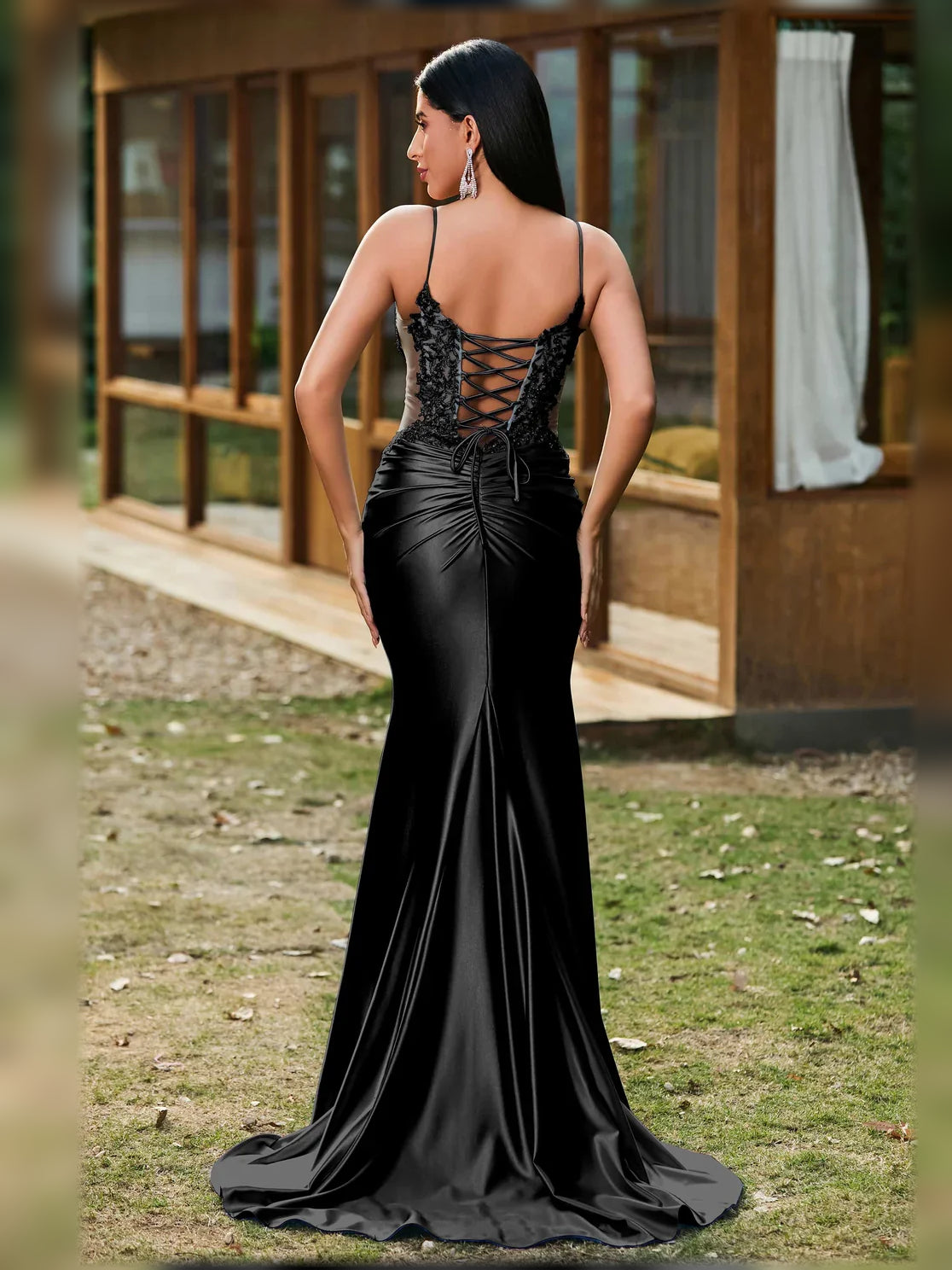Black V-neck corset-style formal dress with lace-up open back
