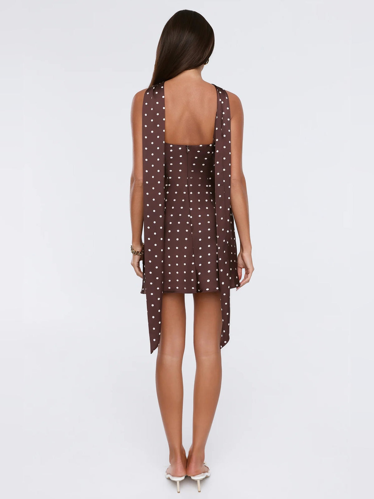 Brown satin halter mini dress, back view with open square back and draped ties