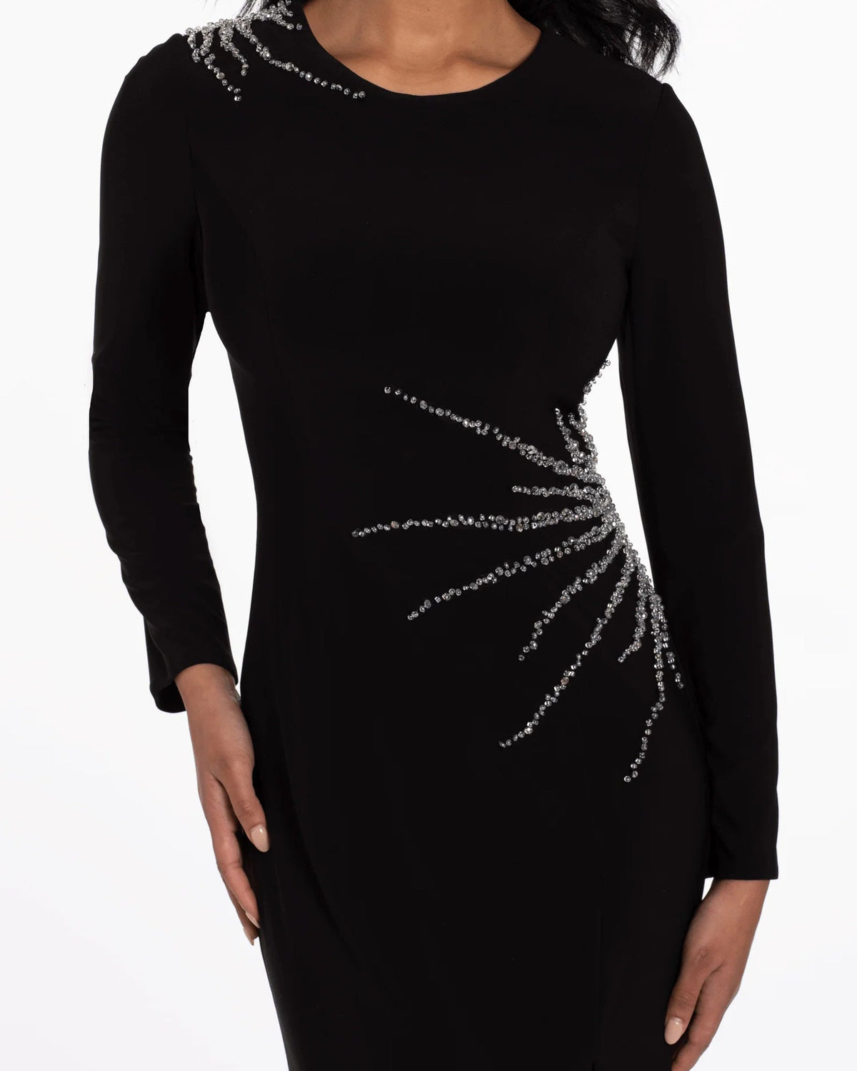 Black long-sleeve column prom dress with silver beaded diagonal swirl at waist