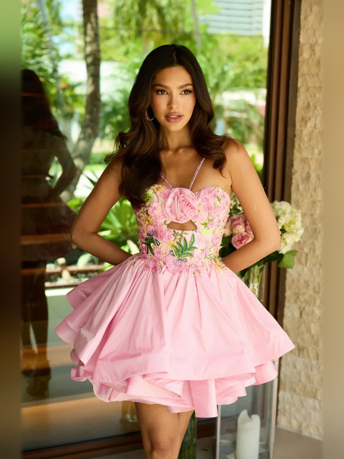 Blush pink floral satin mini dress with sweetheart bodice, rosette detail, and tiered skirt