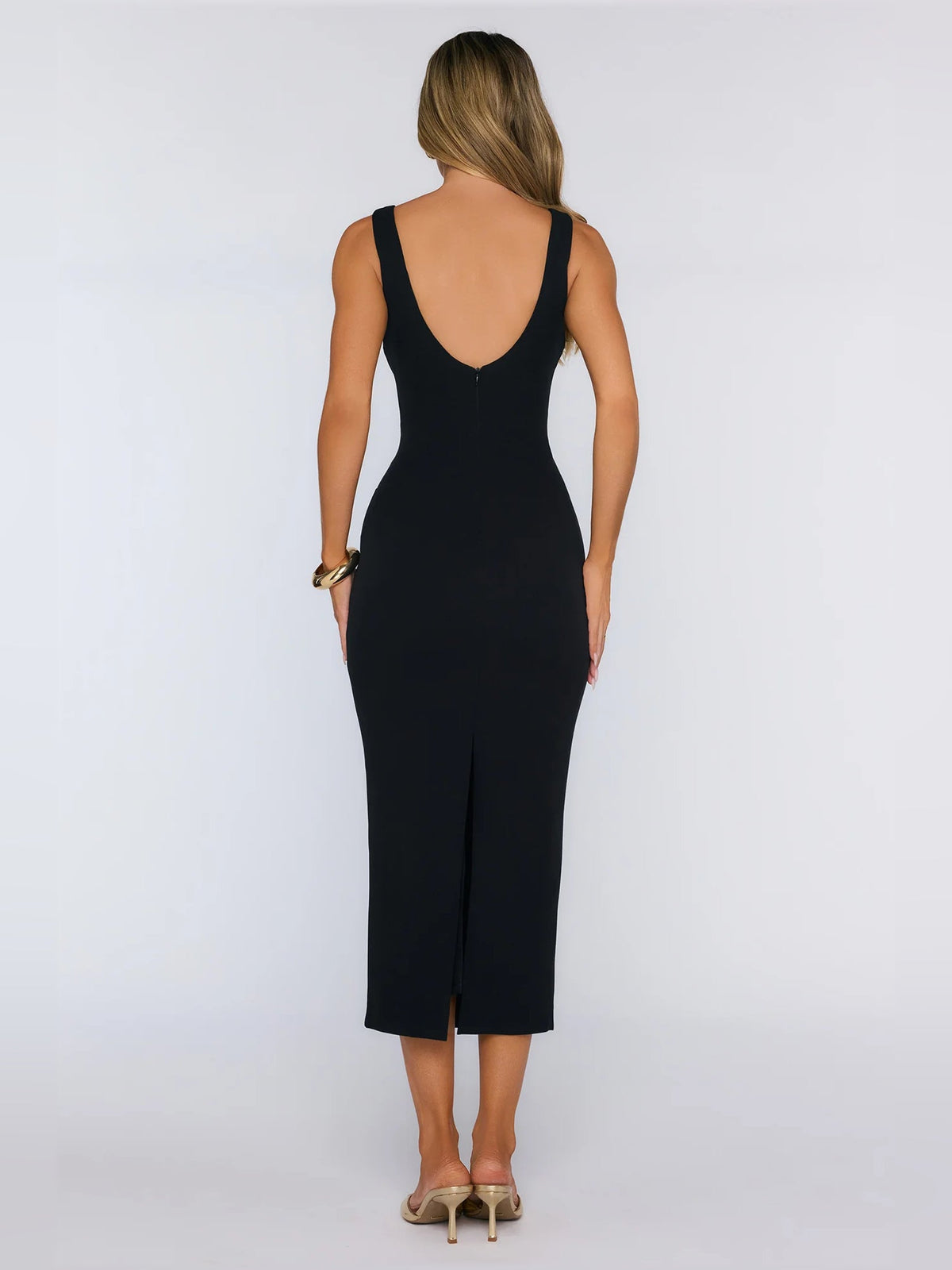 Black midi formal dress back view with thin straps and fitted column silhouette