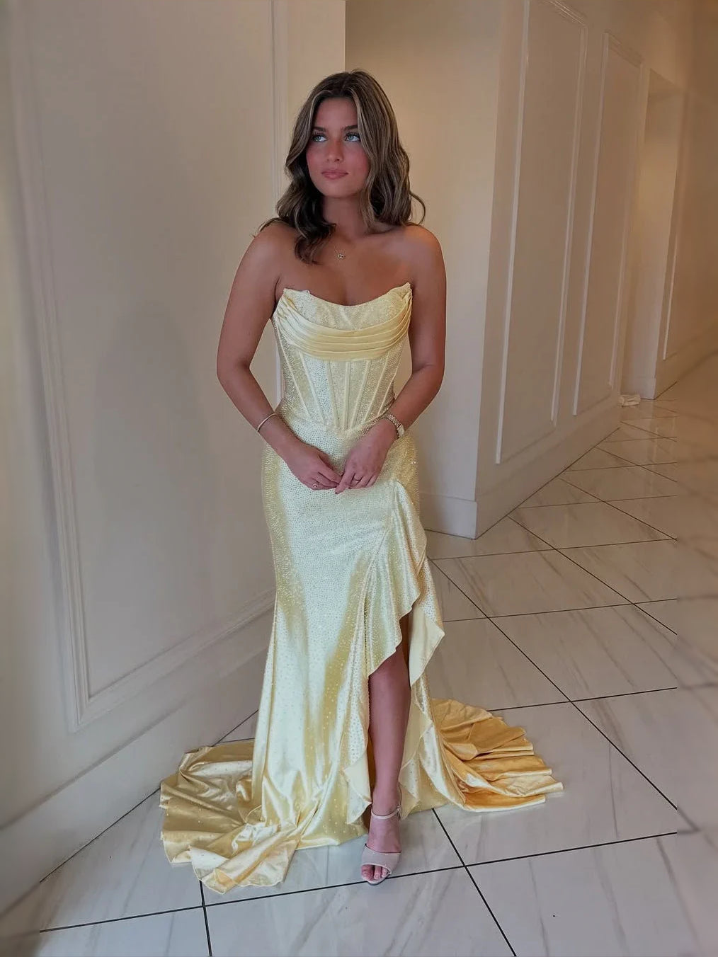 Daffodil yellow strapless corset maxi prom dress with side slit and ruffled train