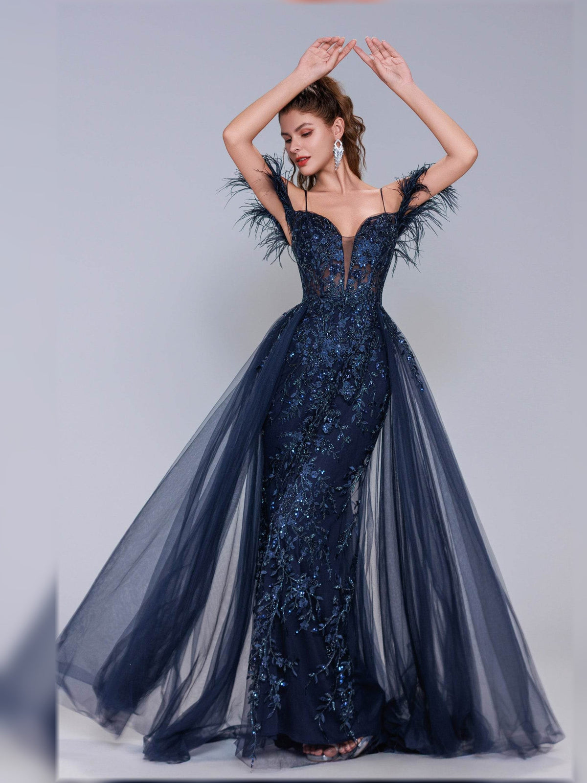 Navy off-shoulder corset formal dress with feather trim, flowing tulle skirt, open back