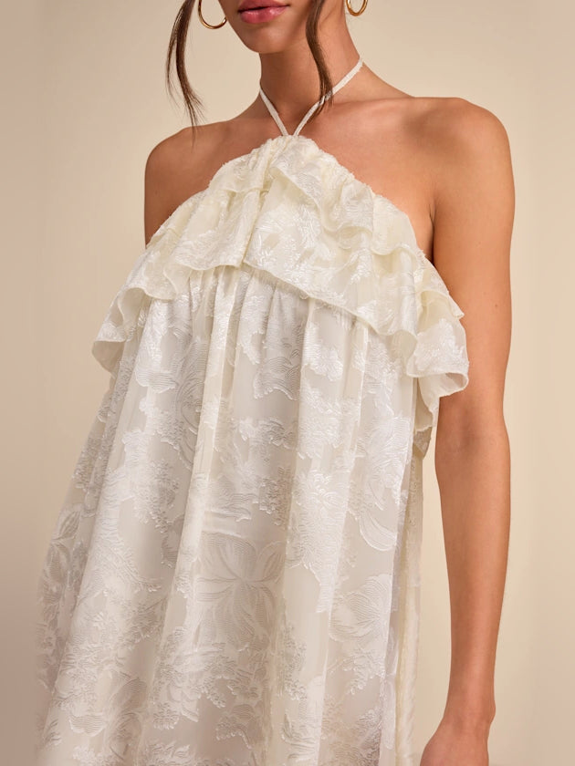 Ivory floral halter mini dress with layered ruffle bodice and tie straps