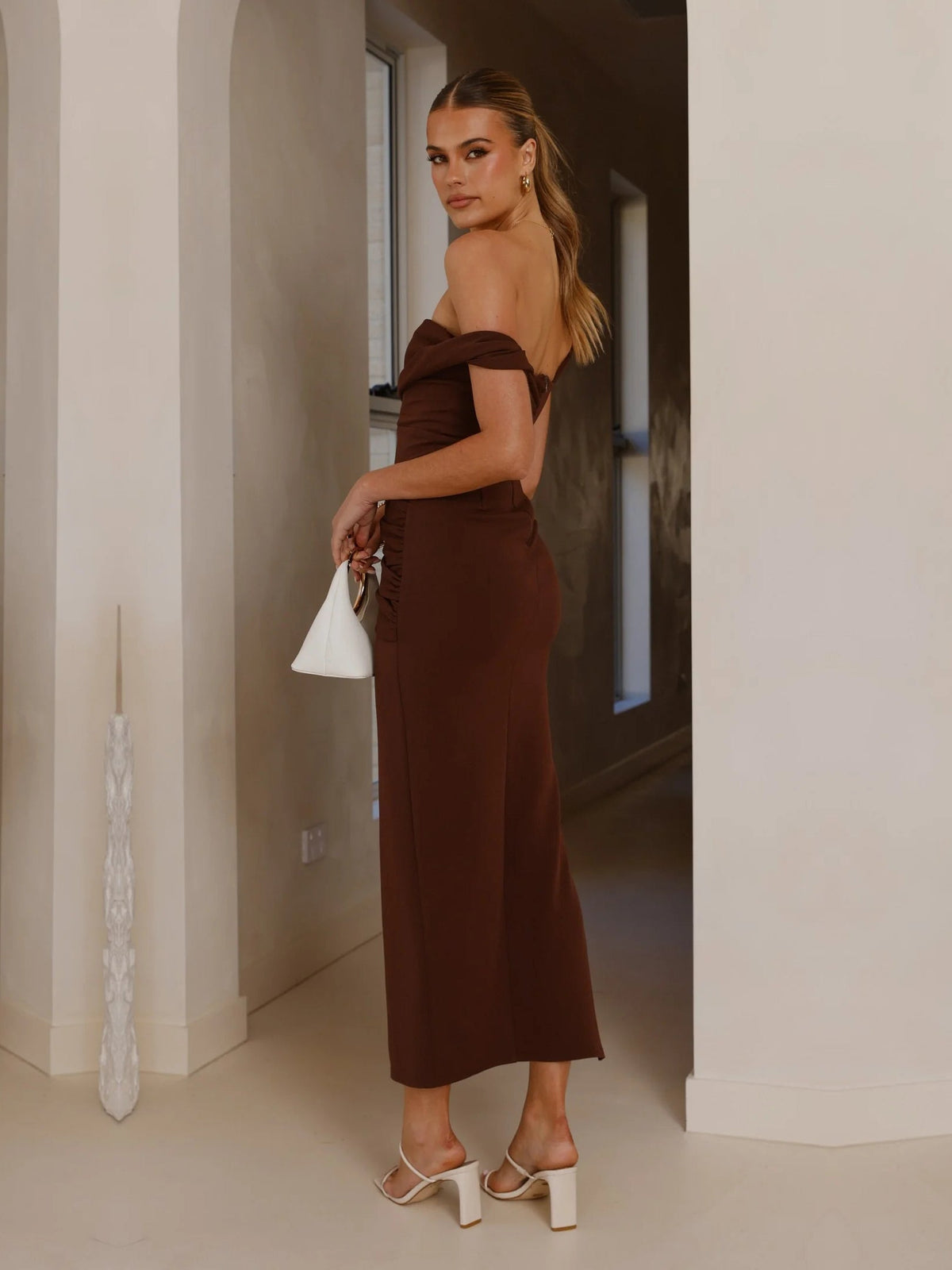 Chocolate sheath maxi formal dress with skirt slit, alternate view showing the hem
