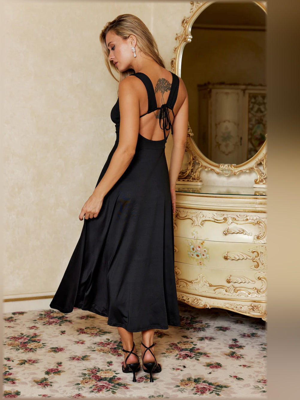 Black midi formal dress, open back with thin crisscross straps and back bow