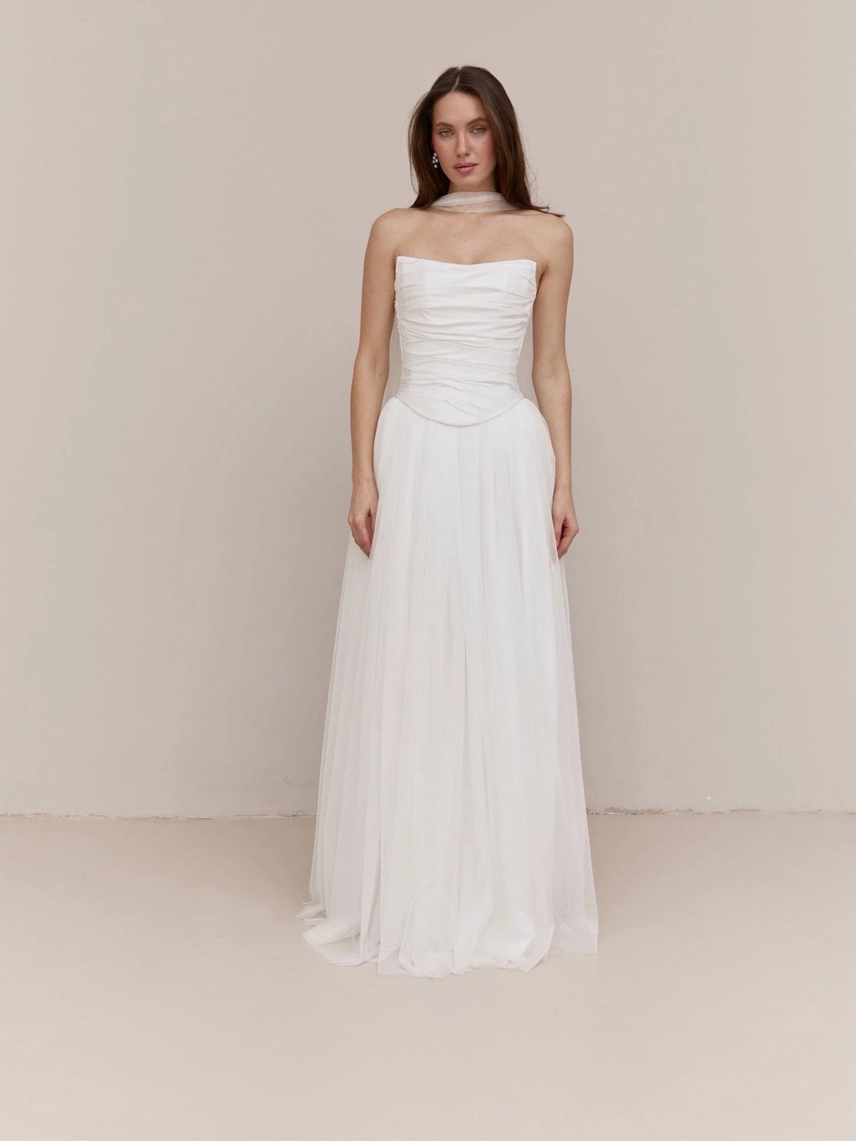 Ivory strapless wedding dress with ruched bodice and soft A-line floor-length skirt