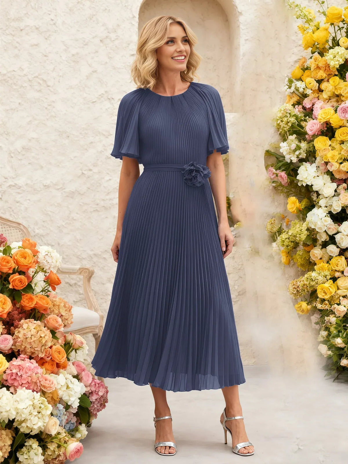 Steel blue pleated chiffon midi A-line dress with flutter sleeves and floral waist detail