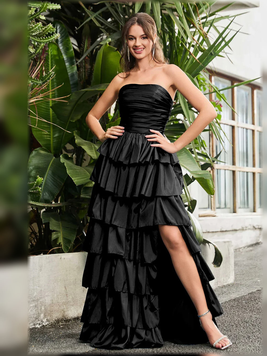 Black strapless tiered formal dress with ruched bodice and side slit