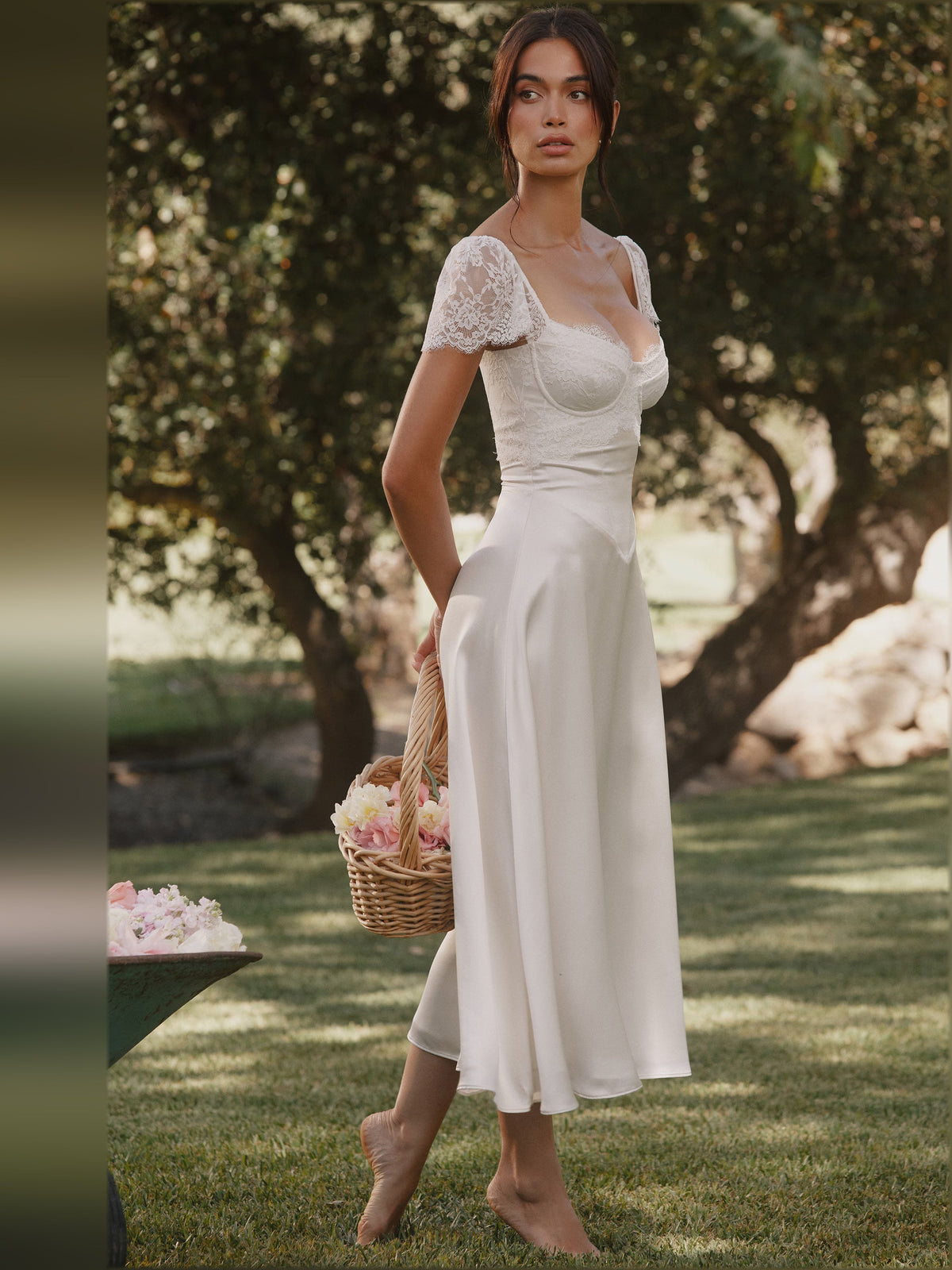 White satin midi dress with lace cap sleeves and smooth draped skirt