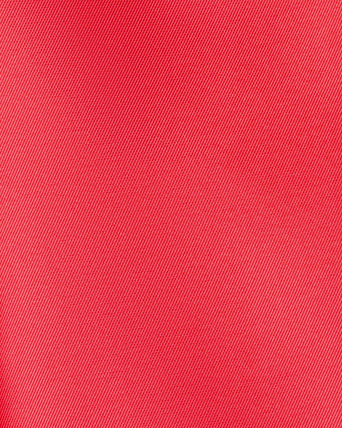 Coral red textured fabric close-up for midi fit-and-flare dress