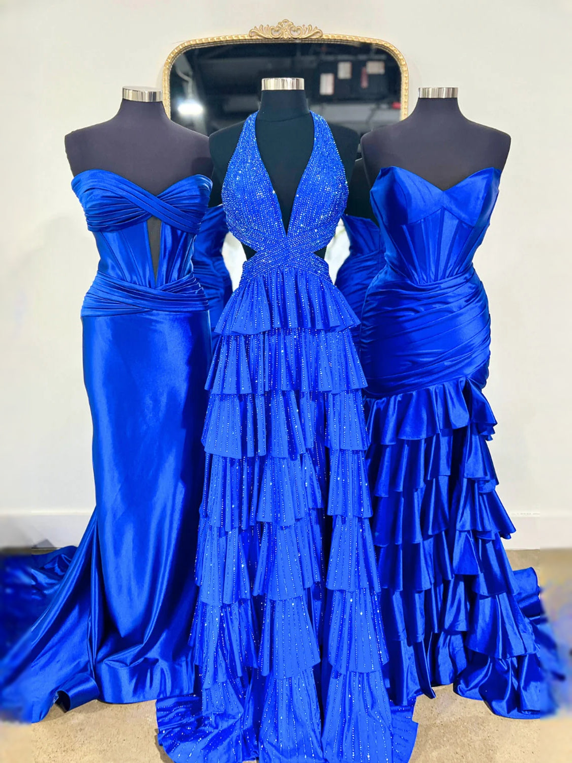 Royal blue V-neck tiered prom dress with glitter beading and layered ruffle skirt