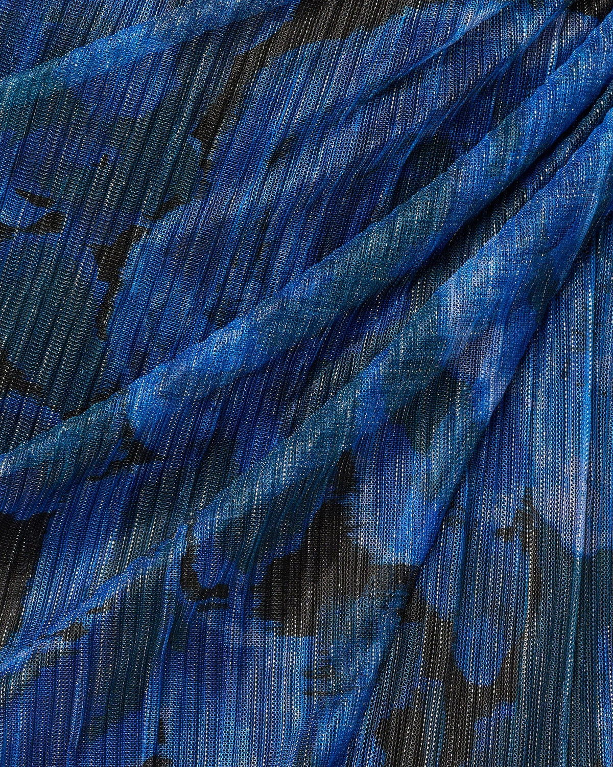 Blue and black textured floral print fabric close-up