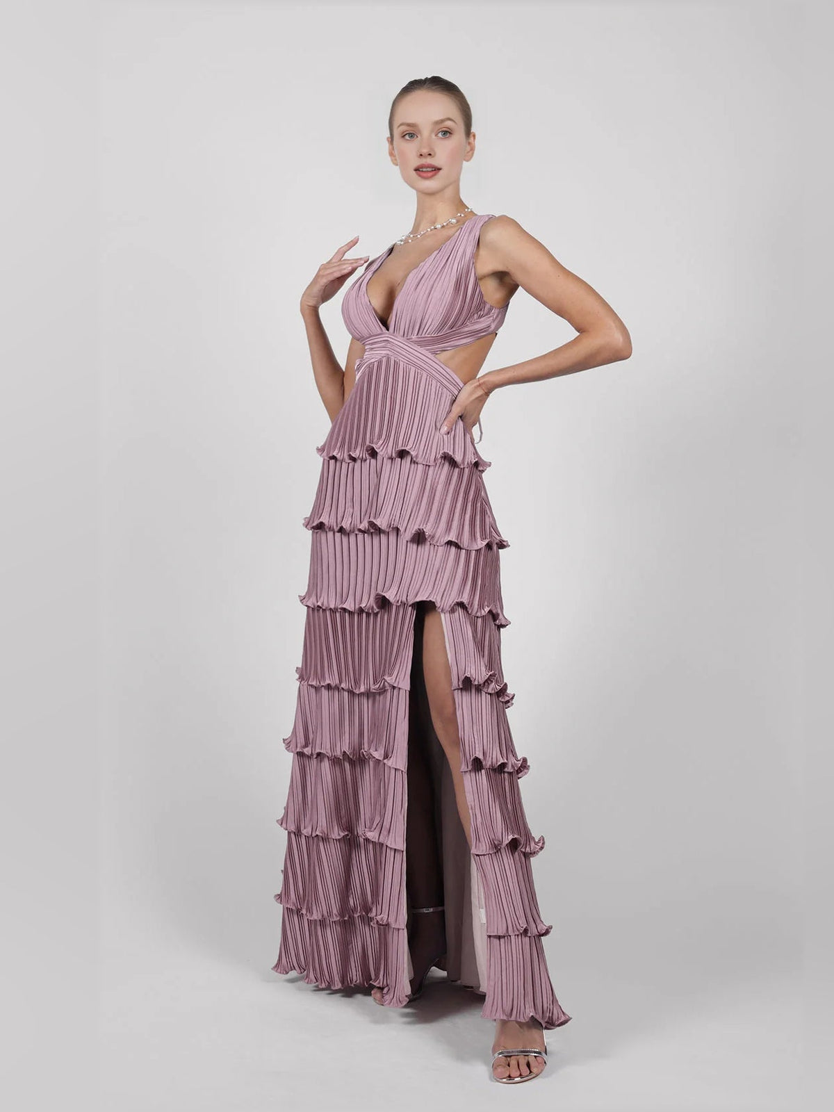 Purple v-neck pleated tiered formal dress with layered ruffle tiers and thigh slit.