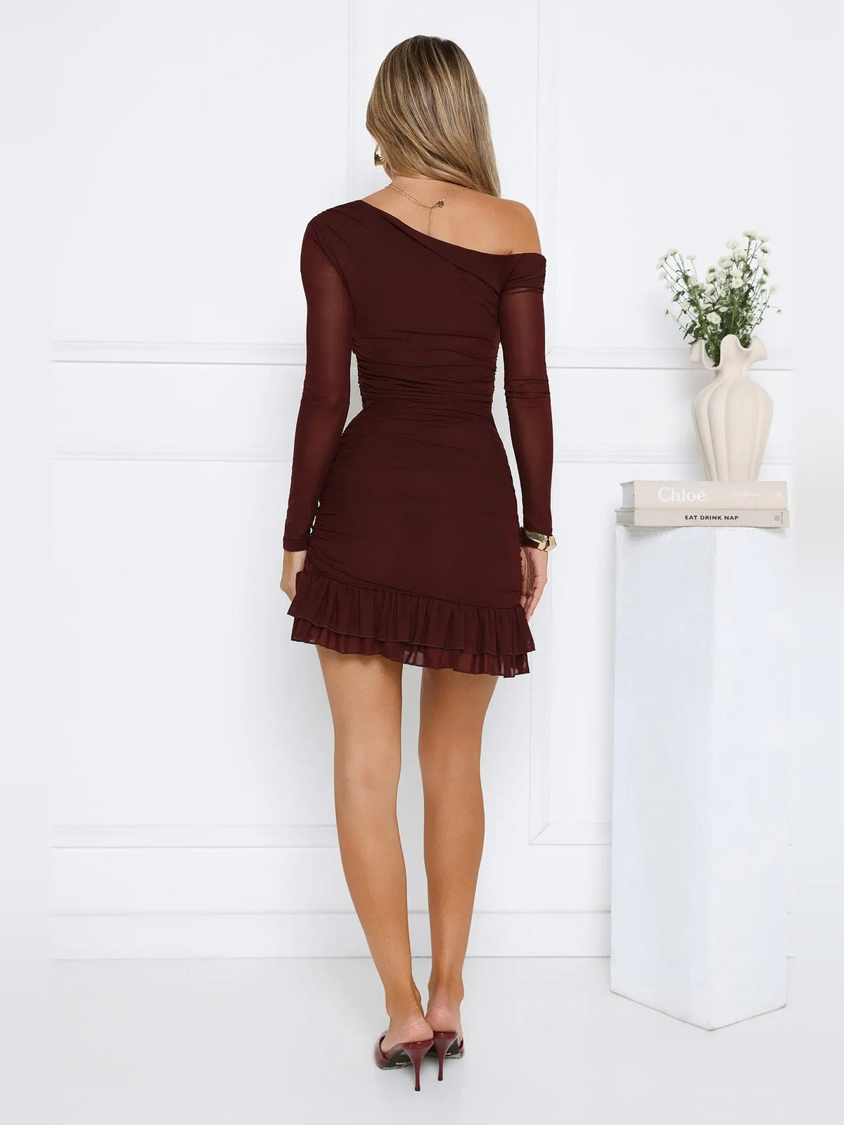 Chocolate off-shoulder long-sleeve mini dress, rear view; tiered ruffle skirt