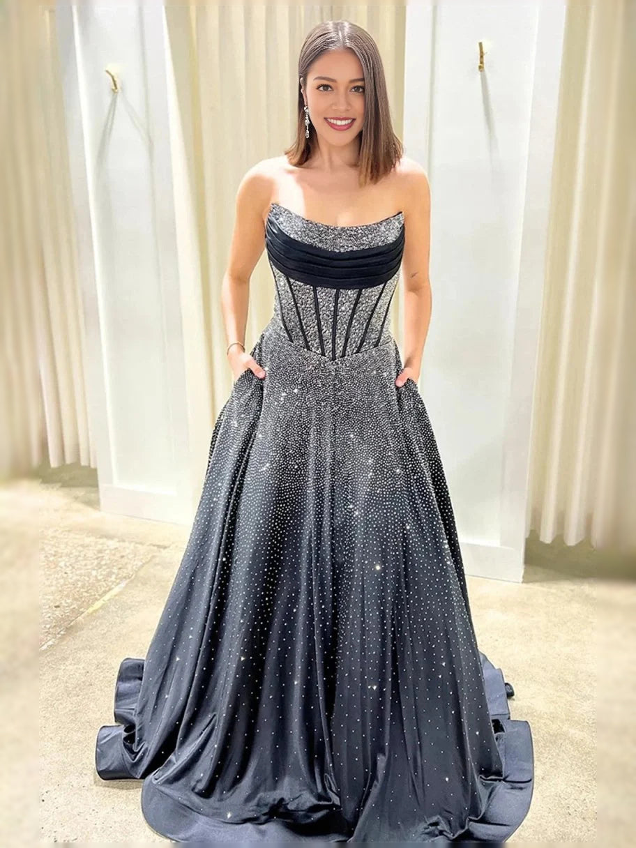 Black strapless ball gown with silver glitter bodice and full floor-length skirt