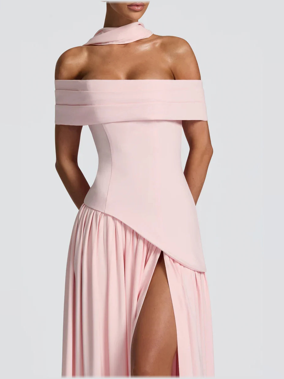 Blush pink off-shoulder dress with diagonal wrap overlay and pleated skirt