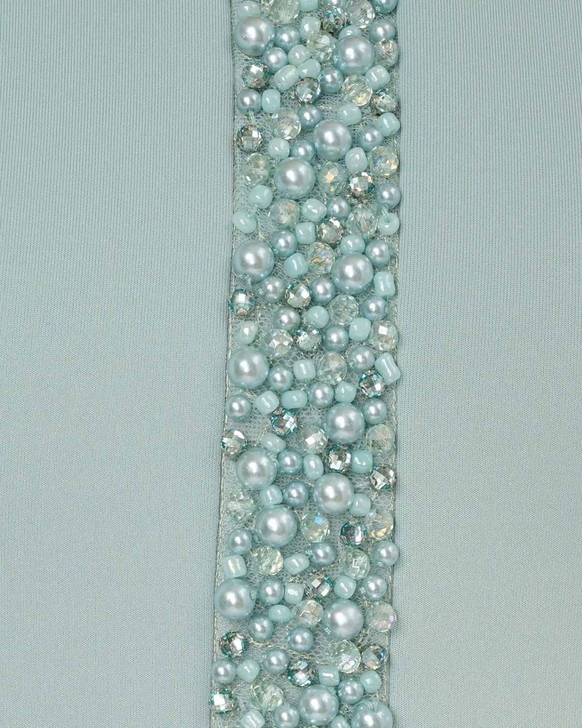 Sparkling mint-tone bead applique on halter neckline panel.