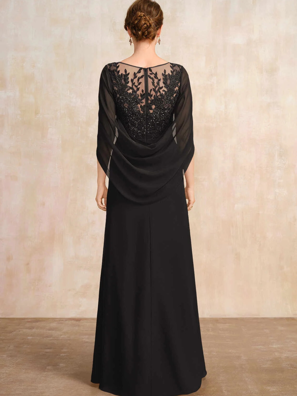 Black chiffon A-line dress with illusion lace back and draped cape sleeves
