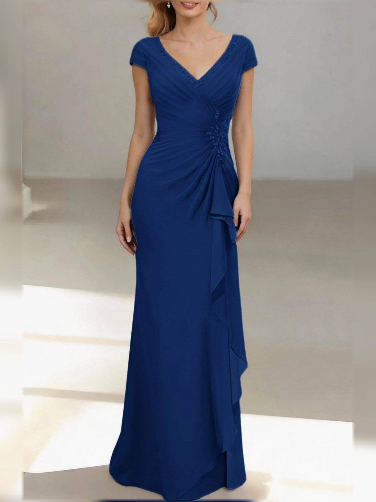 Royal blue V-neck ruched mermaid gown with cap sleeves and draped ruffle skirt