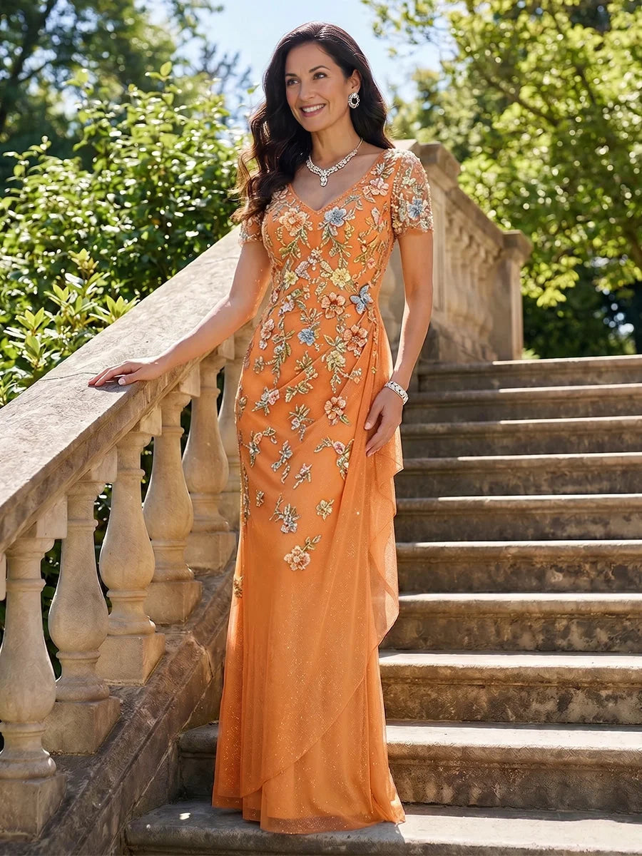 Orange chiffon mermaid dress with V-neck and short sleeves, featuring floral embroidery