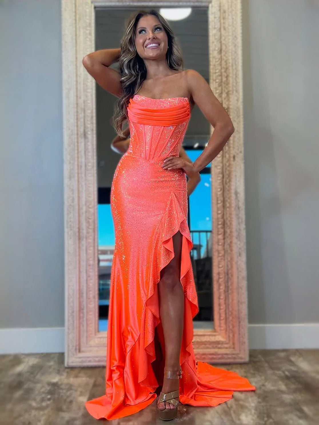 Orange strapless corset maxi prom dress with side slit and ruffled hem