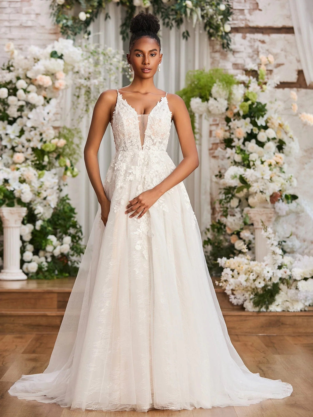 Ivory sleeveless V-neck A-line wedding dress, lace texture on bodice and layered tulle