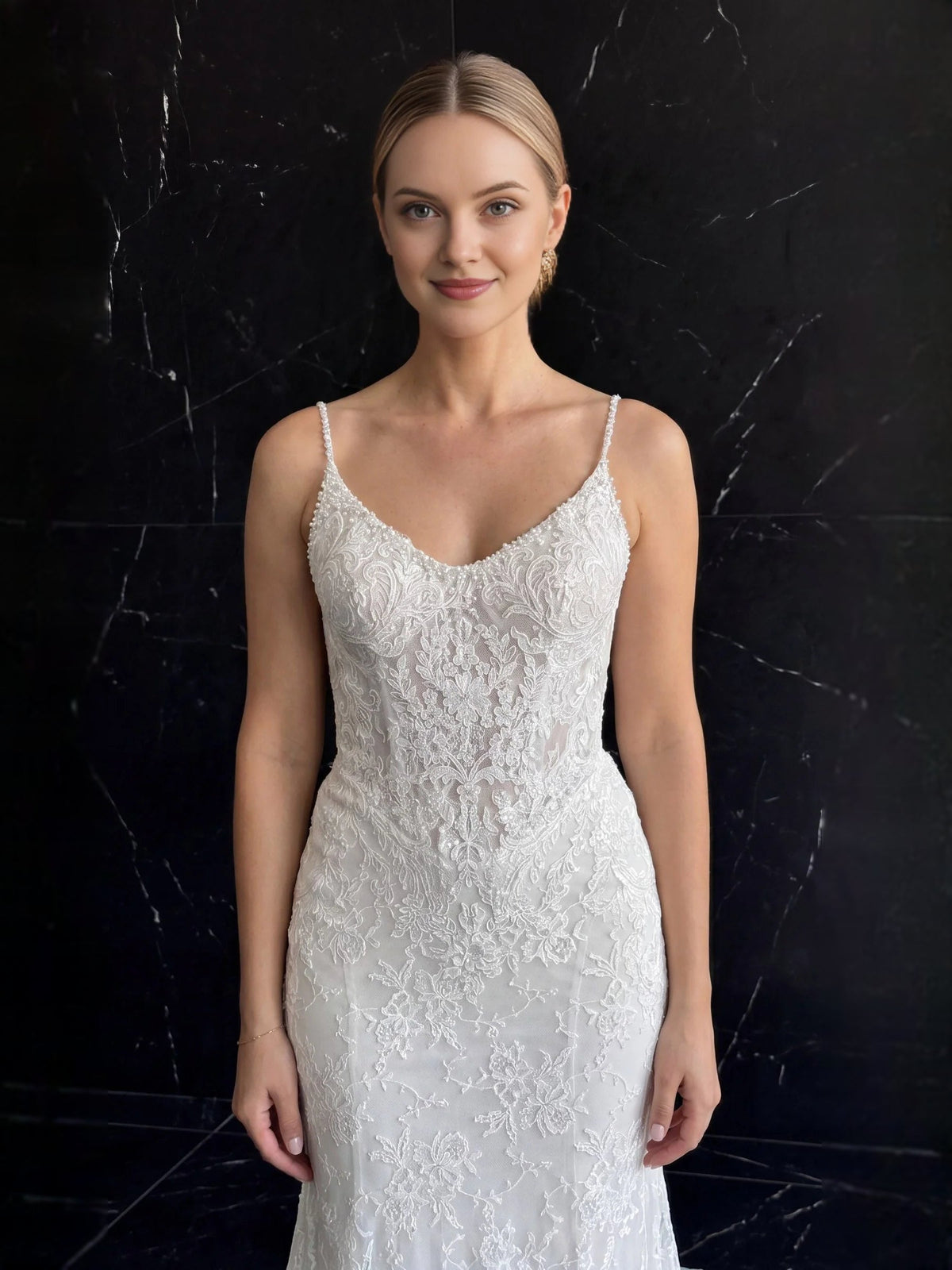 Ivory beaded lace mermaid wedding dress with V-neck bodice and thin straps