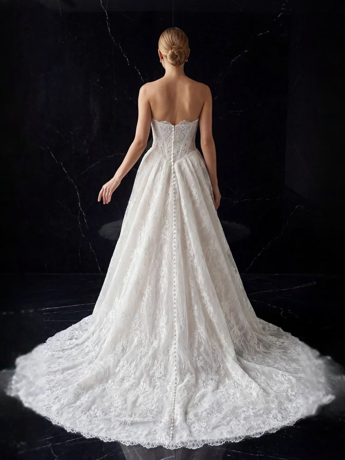Ivory tulle A-line wedding dress back view with lace-up panel and full gathered skirt