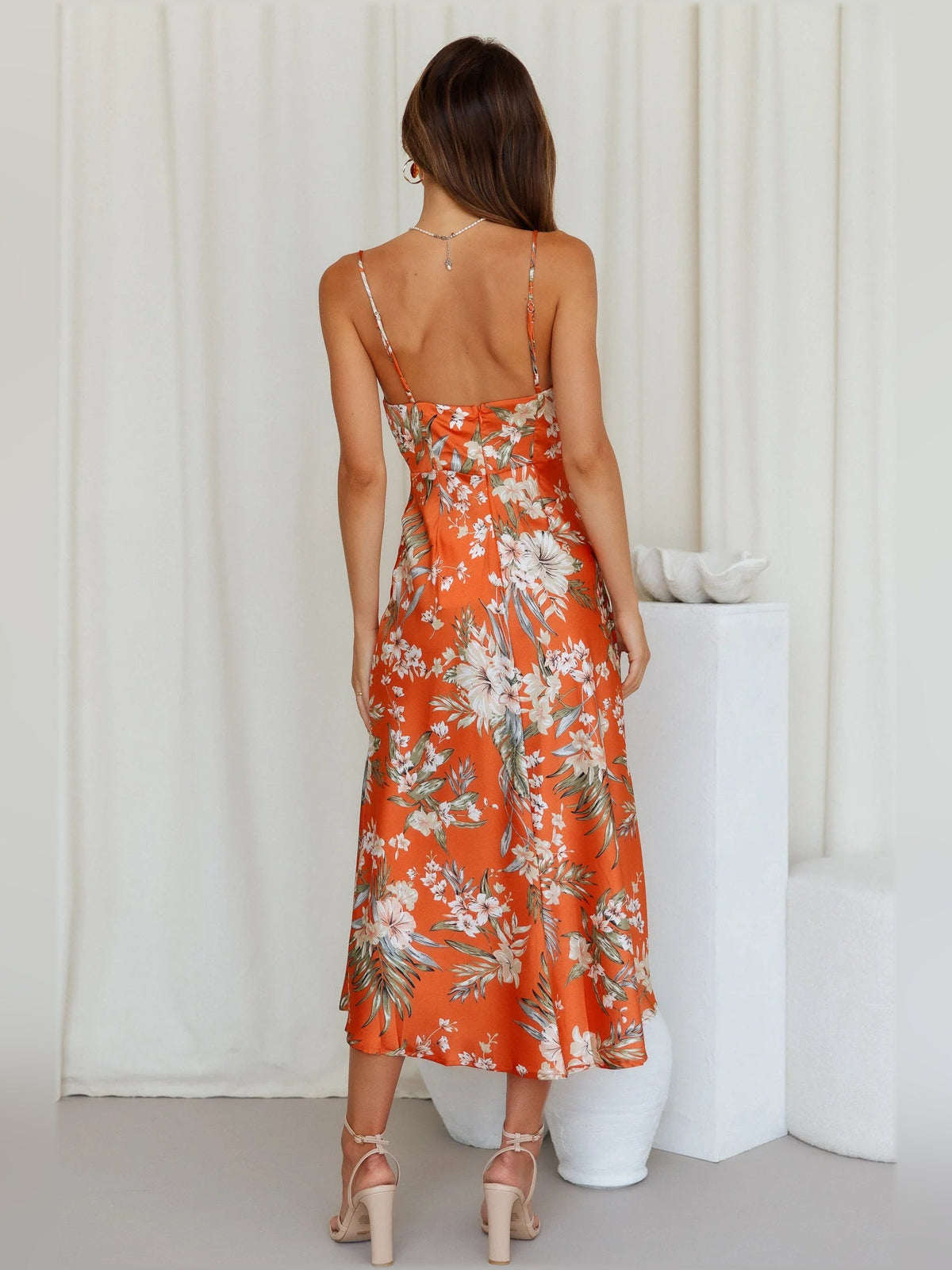 Orange floral midi formal slip dress, back view with thin spaghetti straps